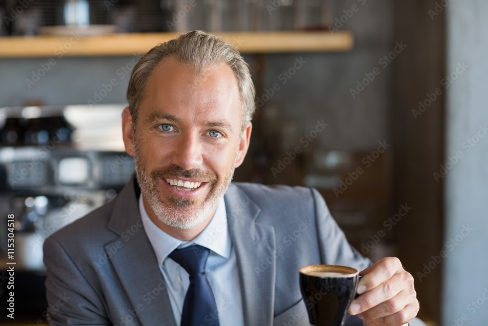 Businessman having coffee in café Businessman having coffee in café