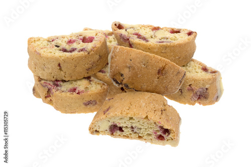 Cranberry almond biscotti with white chocolate on a white background side view.