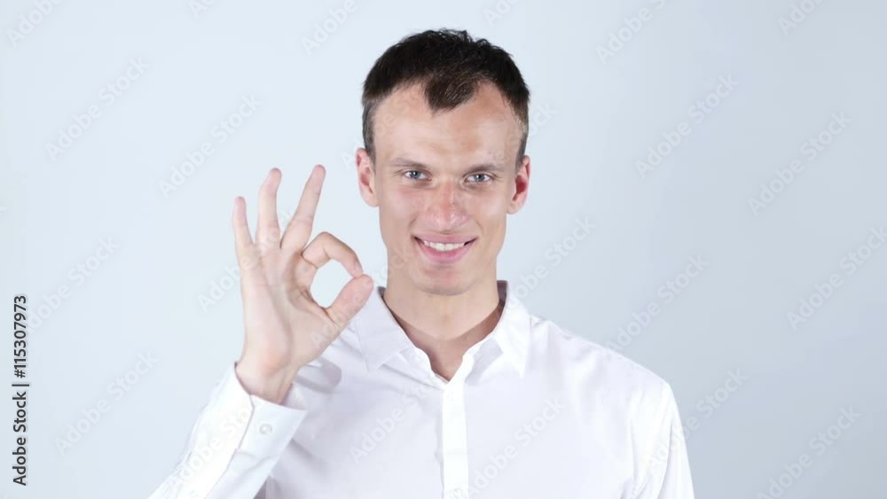 man gesturing OK sign on white background man gesturing OK sign on white background
