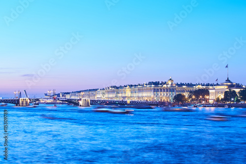 Russia, Saint-Petersburg, 02 July 2016: Opening Palace Bridge, a lot of Observing tourists, Neva River at sunrise, Winter Palace, the Hermitage, the Admiralty, a lot ships and boats, long exposure  © Vladimir Drozdin