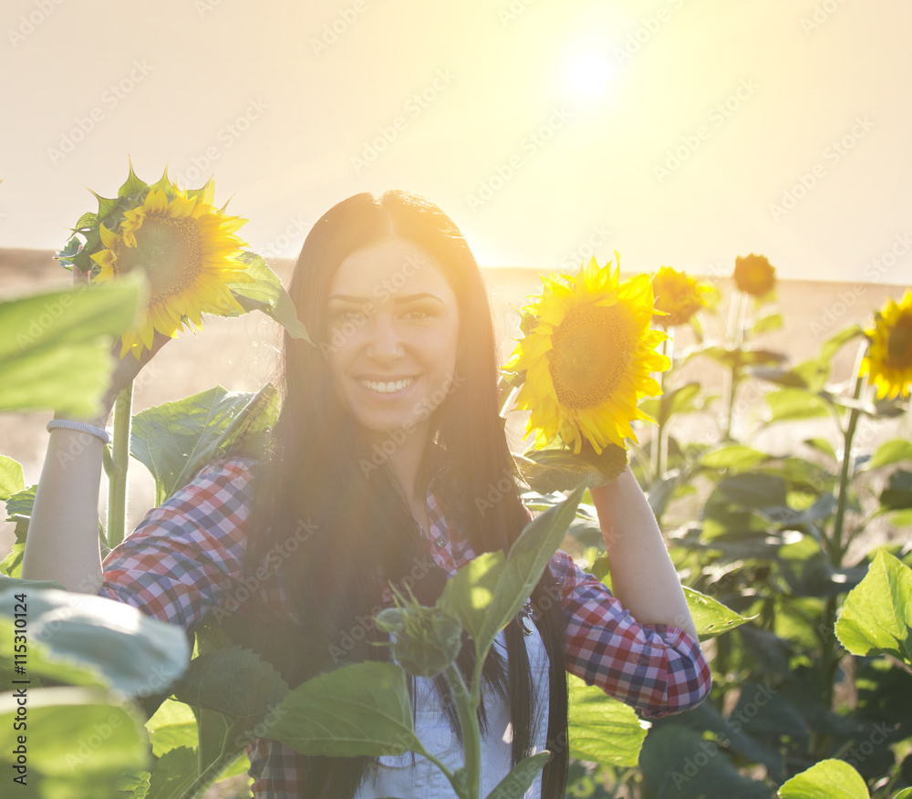 Girl in sunflower field Stock Photo | Adobe Stock
