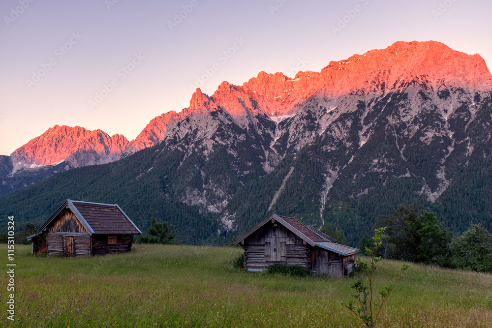 Alpen glow across a mountain range in bavaria Alpen glow across a mountain range in bavaria