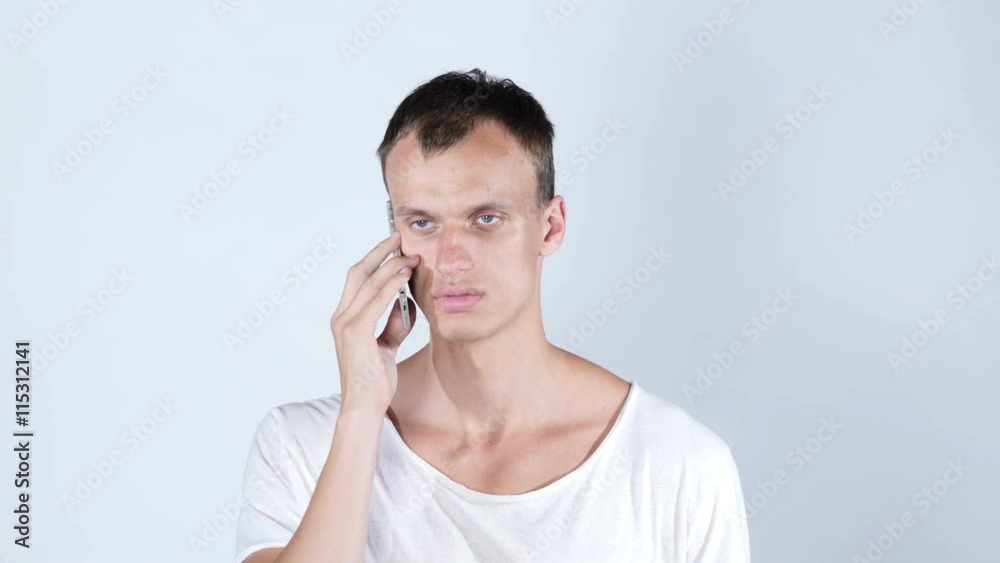 Portrait of handsome , student ,cheerful man talking on the phone Portrait of handsome , student ,cheerful man talking on the phone