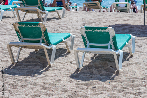 Beach chairs on the shore
