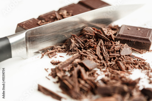 Knife Cutting Dark Chocolate Bar photo