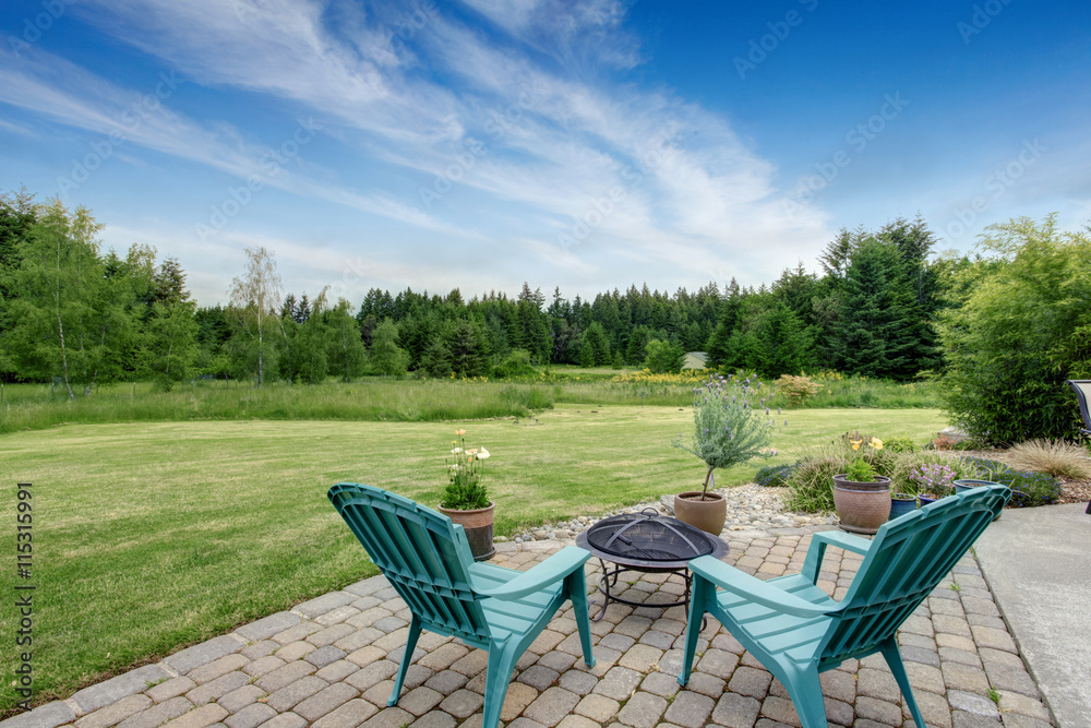 Beautiful house backyard with well kept lawn, trees Beautiful house backyard with well kept lawn, trees