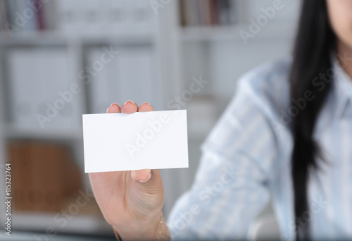 Close-up of business card in women hand