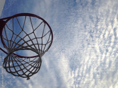 basketball hoop against summer sky at sunset