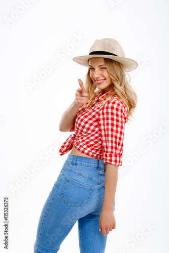 Portrait of beautiful country girl smiling over white background.
