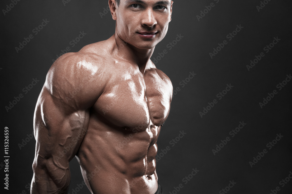 The male body on black background. The male body on black background.