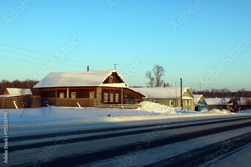Village in a winter day and snow © keleny