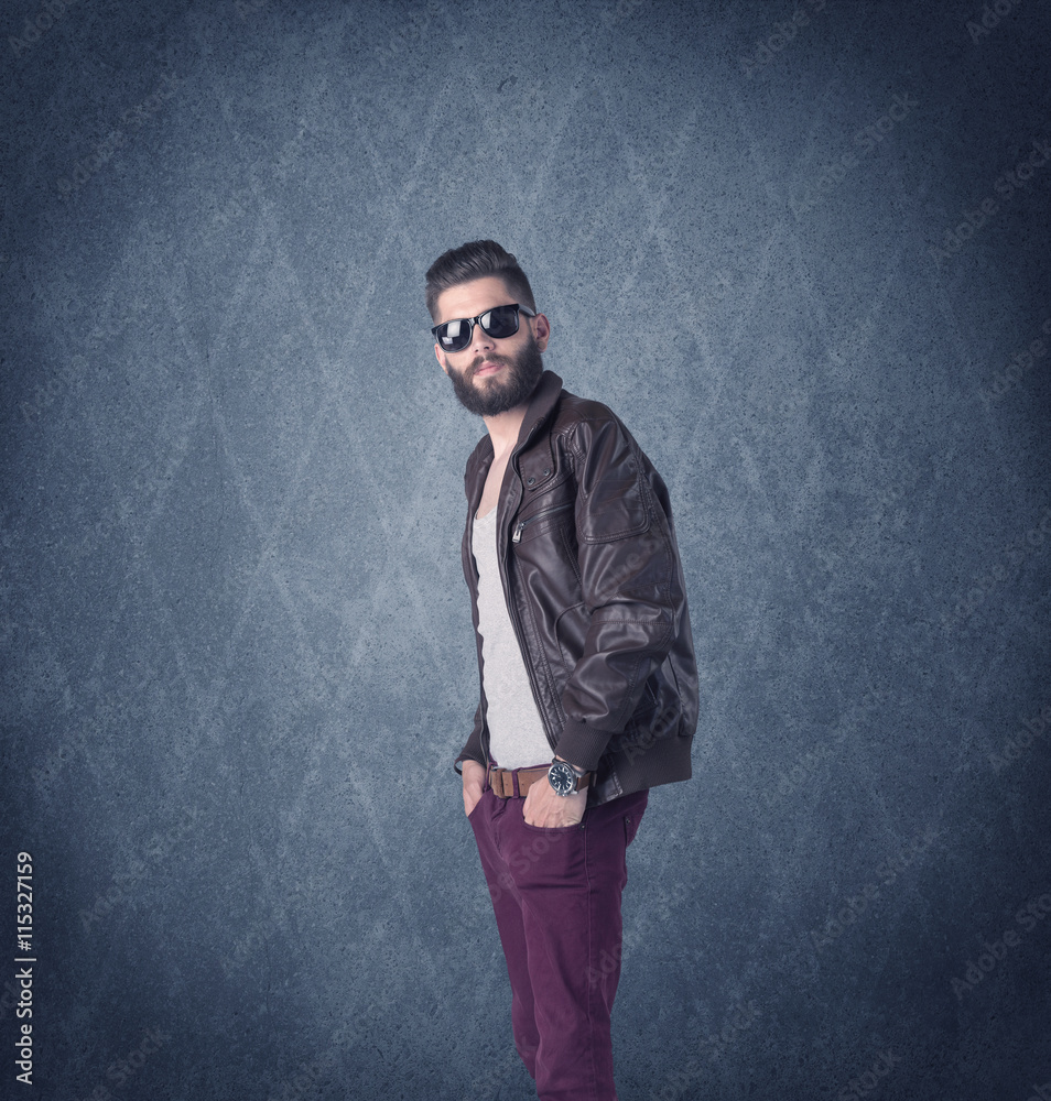 Bearded hipster standing in elegant clothes