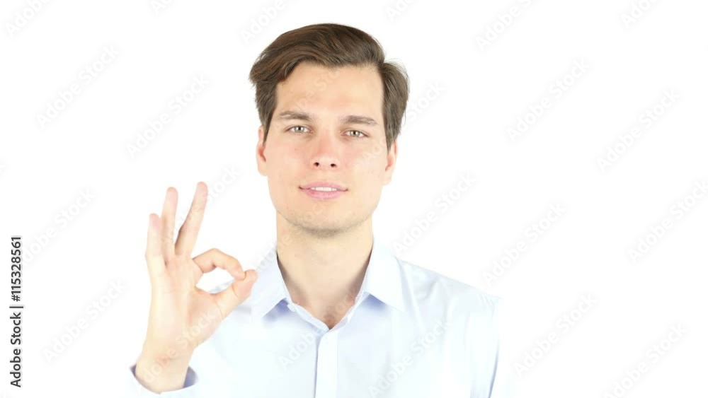 Everything is OK! Happy young man gesturing OK sign and smiling Everything is OK! Happy young man gesturing OK sign and smiling