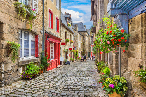 Idyllic scene of traditional houses in narrow alley in an old town in Europe