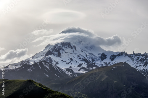 Snow peak of Mount Kazbek in the evening. Georgia