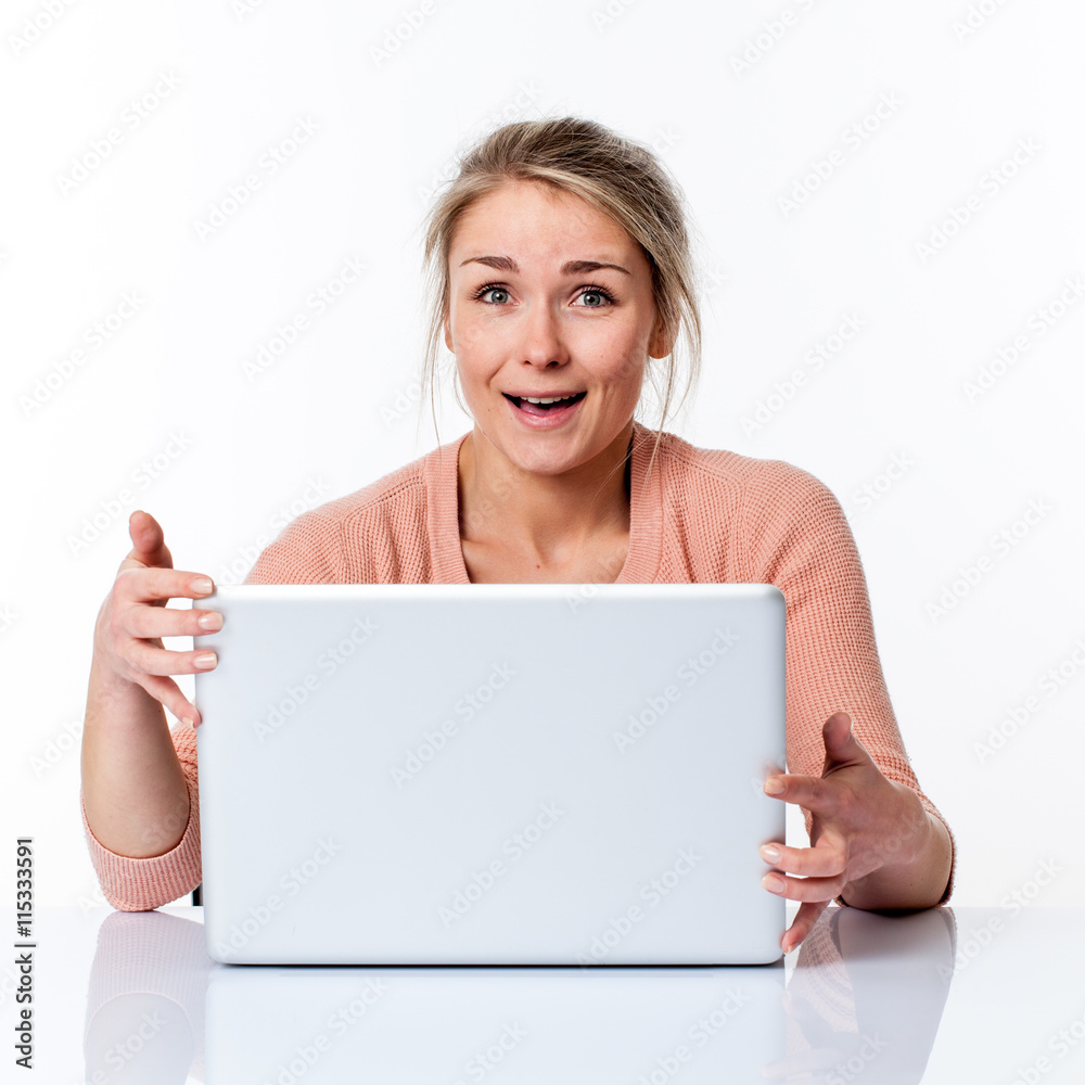 laughing beautiful young blond business woman holding her laptop laughing beautiful young blond business woman holding her laptop
