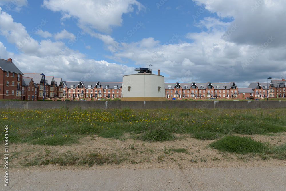 Martello tower at Felixstowe with many houses behind Martello tower at Felixstowe with many houses behind