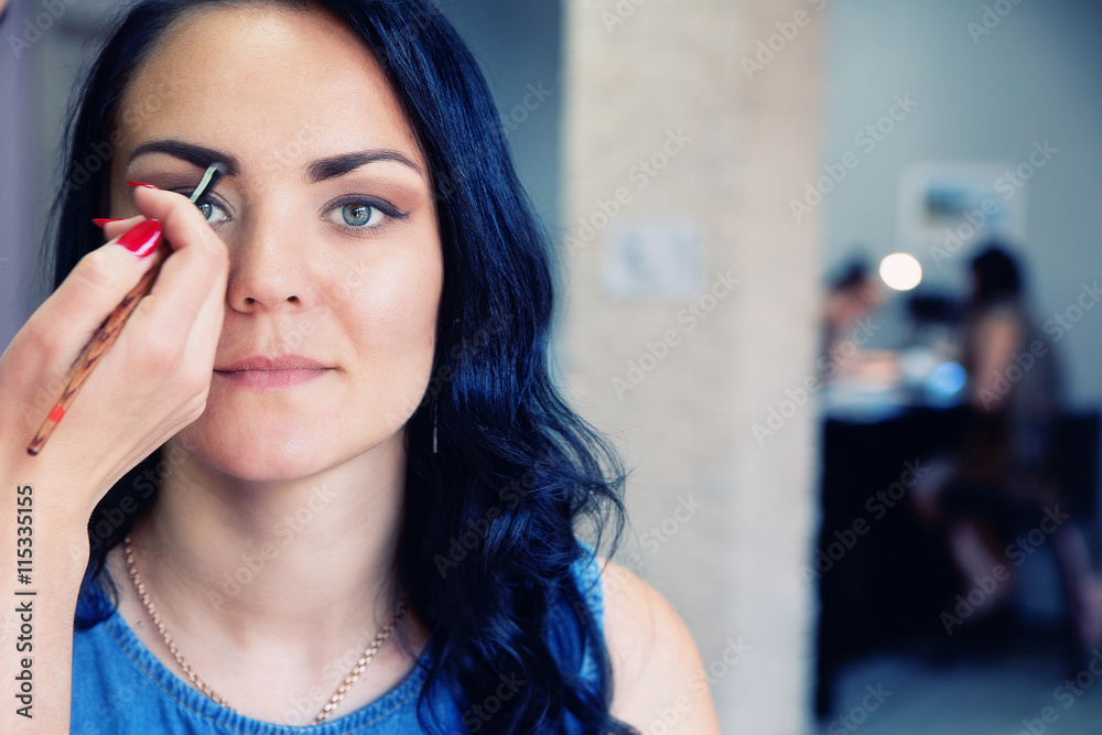 Professional makeup artist doing makeup Professional makeup artist doing makeup