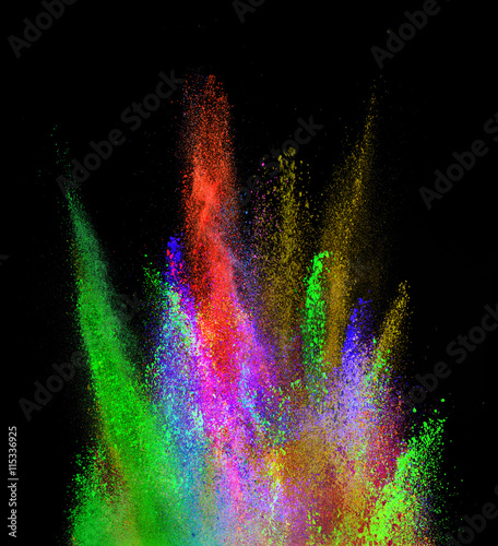 Explosion of colored powder on black background