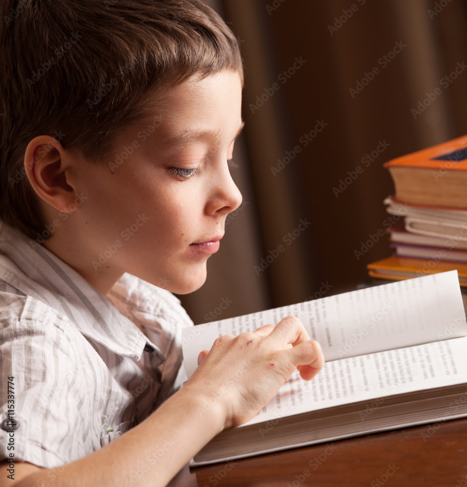 Boy reading book Boy reading book
