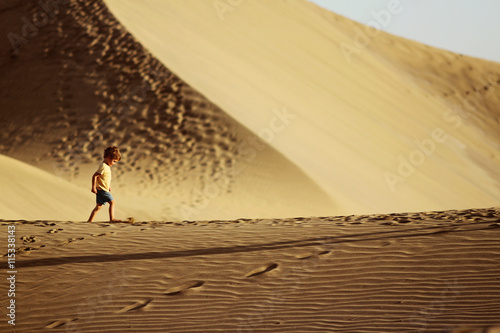 Boy in a desert photo