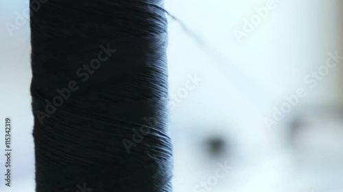  spool of sewing thread on the sewing machine, close-up