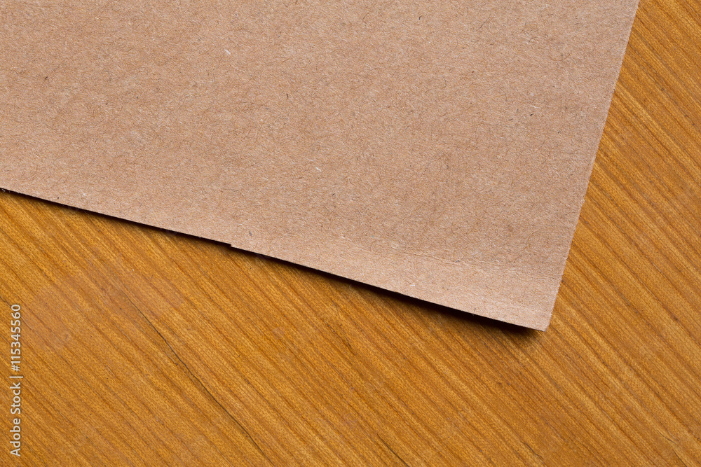 Kraft paper on wooden table Kraft paper on wooden table