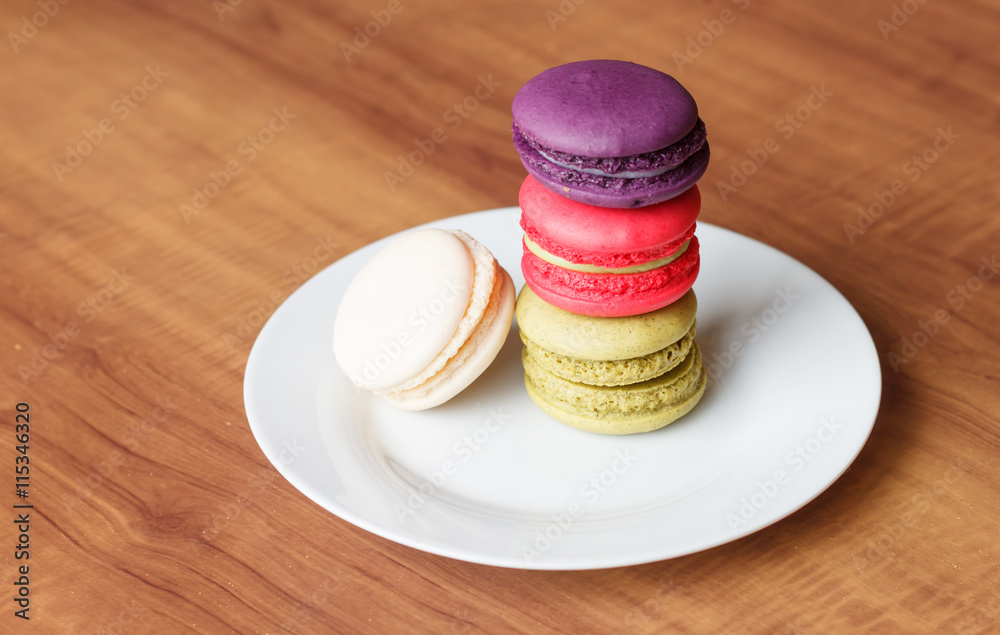 Colorful French Macarons on wooden background. Colorful French Macarons on wooden background.
