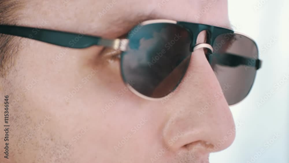A man in sunglasses reflecting the clouds timelapse A man in sunglasses reflecting the clouds timelapse