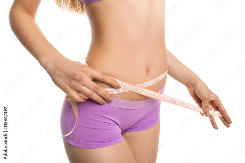 Model measuring her waist