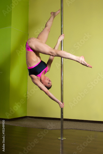  Woman in the pole dance studio