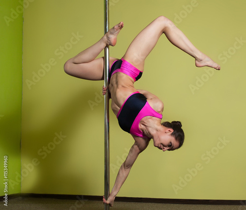 Woman in the pole dance studio