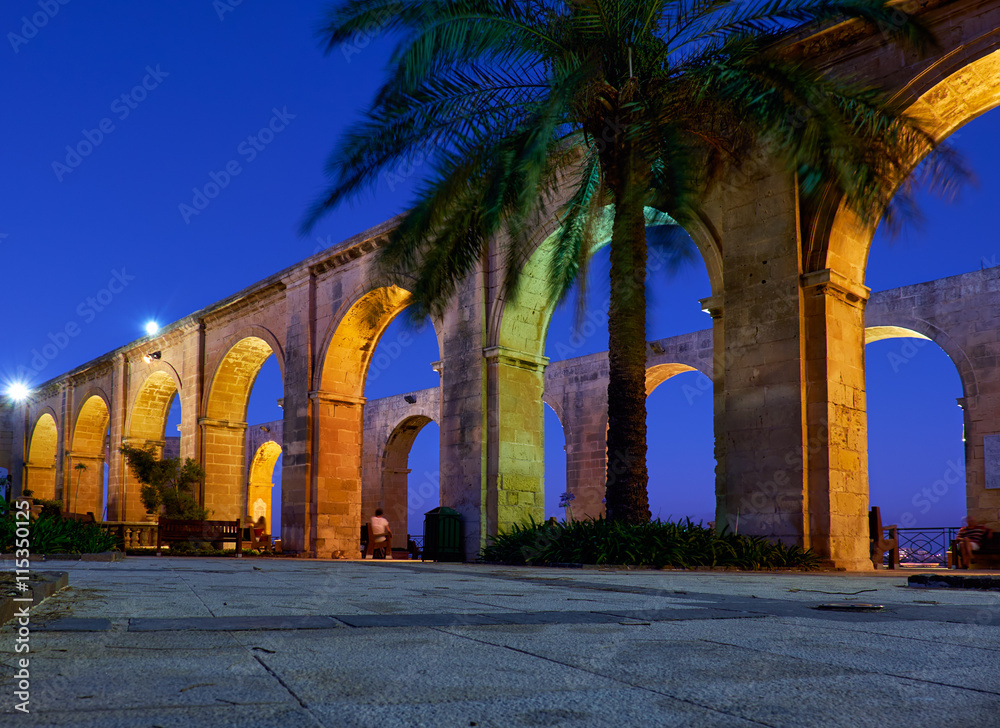 The night view of the Upper Barrakka Garden's terraced arches in