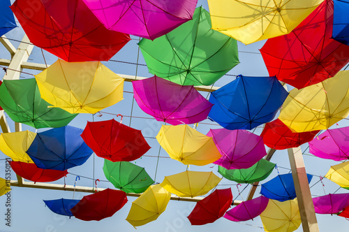 Reversely swinging umbrellas photo