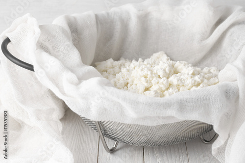 Cottage cheese in cheesecloth photo