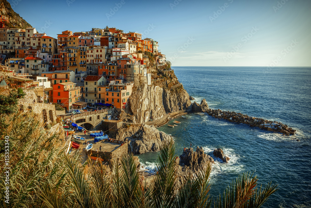 A film-like view over Manarola, one of the five famous villages that form Cinque Terre, with a special a Kodachrome emulation colour grading. Two other colour grading versions are available
