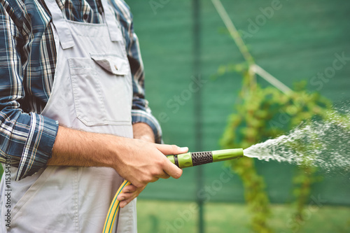 Working watering garden from hose © nikolaborovic88
