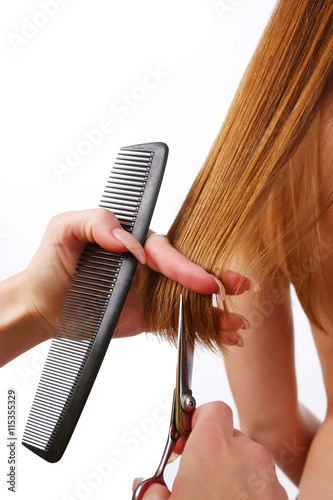 woman with scissors and comb