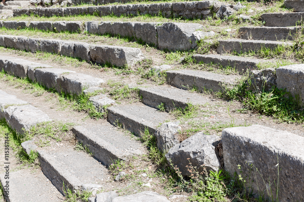 Stairs and seats of a historic Greek theatre at Taormina, Sicily