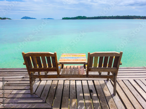 Couple beach chair on the sea beach wooden pier bridge  Thailand