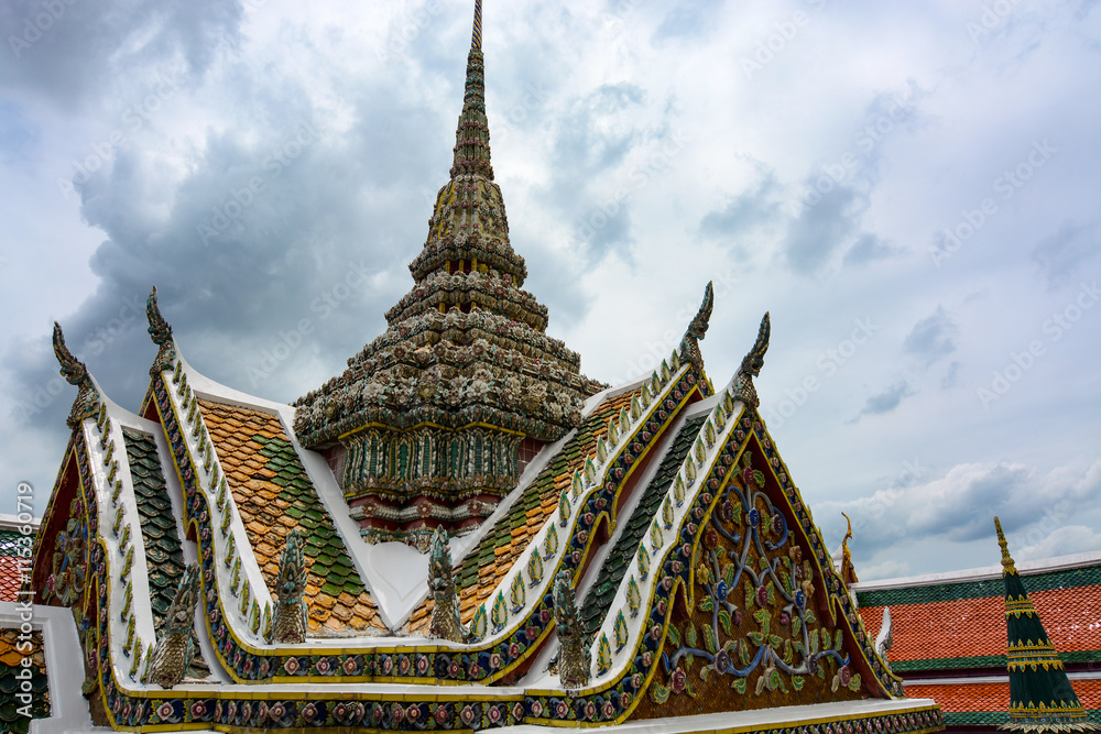 Fototapeta premium Ornate roof and spire at the historic Grand Palace in Bangkok, Thailand