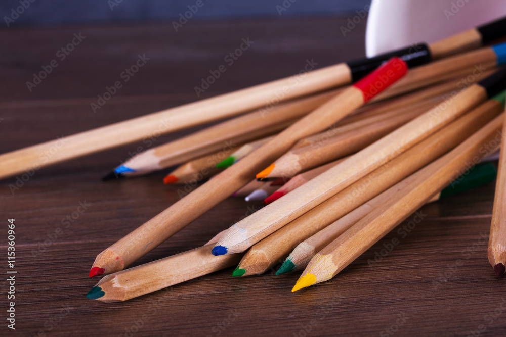 Coloured pencils on a worn black background Coloured pencils on a worn black background
