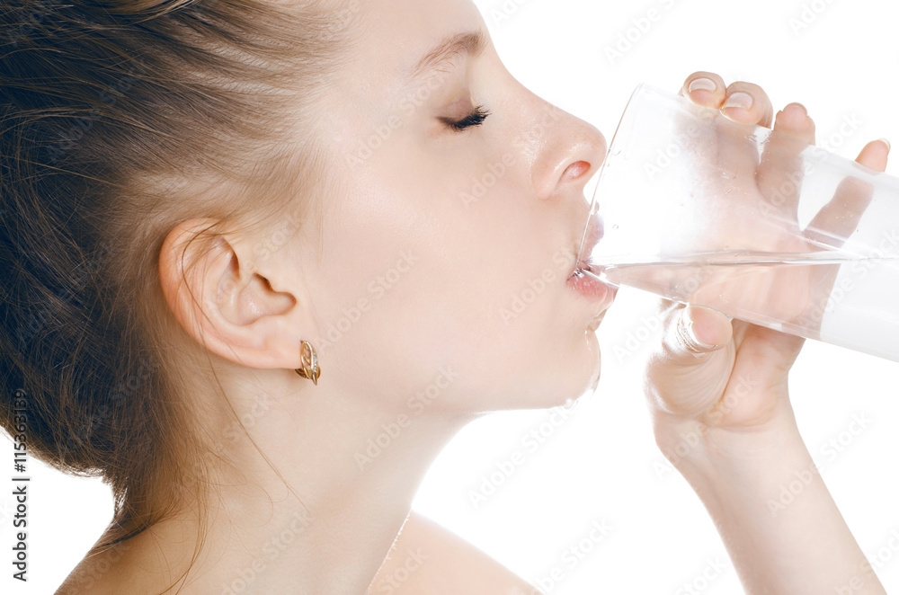 young woman drinking water, on white background young woman drinking water, on white background