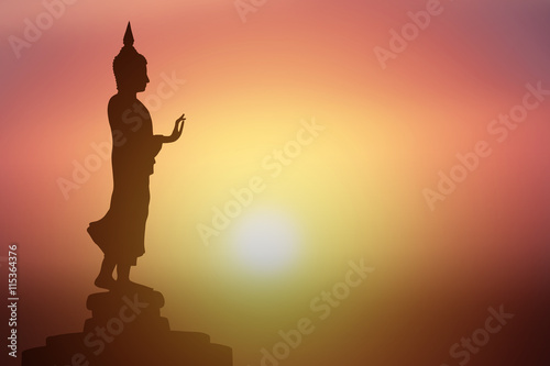 Silhouette of Buddha.Background sunrise