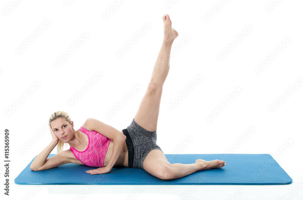 Woman doing stretching exercises.. Woman doing stretching exercises..