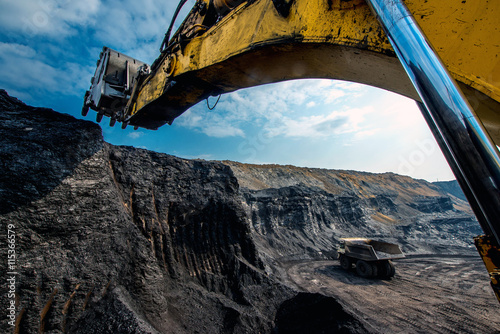 Excavator at work in open pit