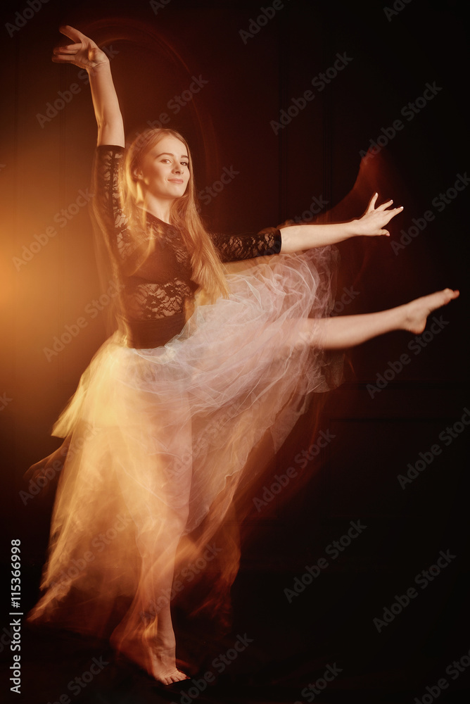 Fototapeta premium young beautiful dancer girl dancing and jumping, studio