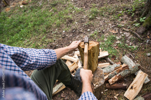 a man chopping wood in the forest
