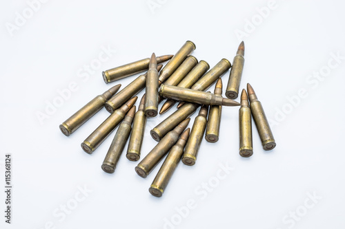 old rifle cartridges 5.56 mm on a white background