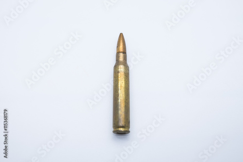old rifle cartridges 5.56 mm on a white background